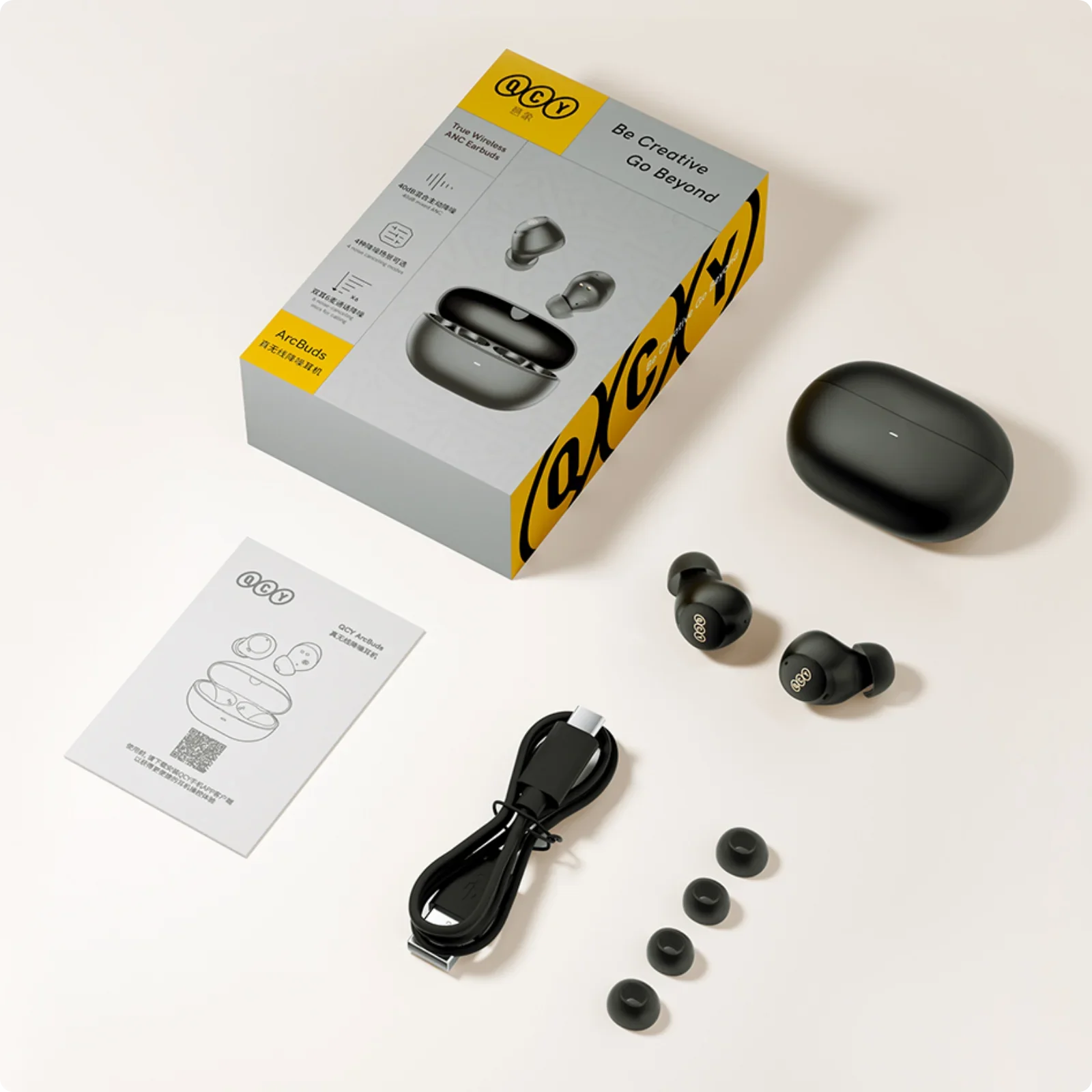 Fones de ouvido sem fio QCY ArcBuds com estojo de carregamento, cabo USB-C e ponteiras extras.